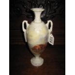 A PORCELAIN TWO HANDLED URN SHAPED VASE with hand painted Highland Cattle scene, signed J.