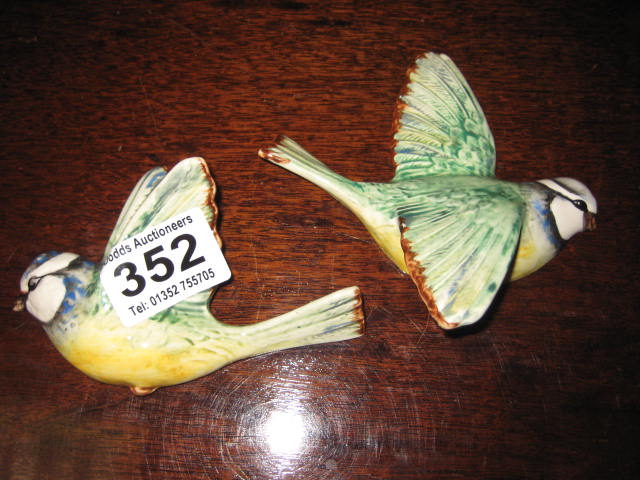 A PAIR OF POTTERY WALL PLAQUES of Blue Tits, 707, 705, Beswick
