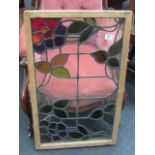 A RECTANGULAR COLOURED AND LEADED LIGHT WINDOW, 30.5" x 17.5", in a retaining frame