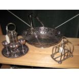 A PLATED FOUR EGG CRUET, A SWING HANDLE BASKET and A TOAST RACK