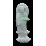 * Carving. A well carved Chinese jadeite figure depicting Guanyin, standing on a lotus base,