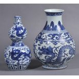 * Chinese Blue and White Ware. A Chinese porcleain double-gourd vase, decorated with five-toed