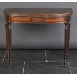 * Table. A George III mahogany tea table, the D-shaped folding top with reeded edge on four fluted