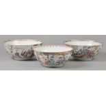 * Chinese Export Ware. A group of three Chinese export porcelain bowls, each decorated with figures,