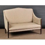 * Sofa. An Edwardian arched sofa, with striped upholstery on mahogany line inlaid supports, 89cm