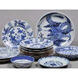 * Chinese Ceramics. A collection of Chinese porcelain plates and dishes, mostly with blue and