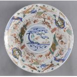 * Japanese Dish. A large Japanese porcelain charger decorated with an unusual design of