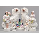 * Staffordshire. A collection of 19th century Staffordshire pottery, including a pair of spaniels,