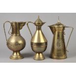 * Brassware. A Victorian Ecclesiastical brass lidded jug, with cross finial, and engraved 'ihr',