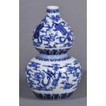 * Chinese Vase. A Chinese porcelain double-gourd form vase, decorated with scholars objects