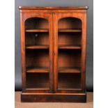 * Bookcase. A Victorian walnut bookcase, the rectangular top with rounded corners above two glazed