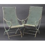 * Garden chairs. A fine pair of Edwardian period painted metal garden chairs, with scroll frames,