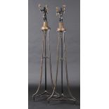 * Candle Stands. A pair of late 18th century parcel gilt Neo Classical torcheres, each with winged