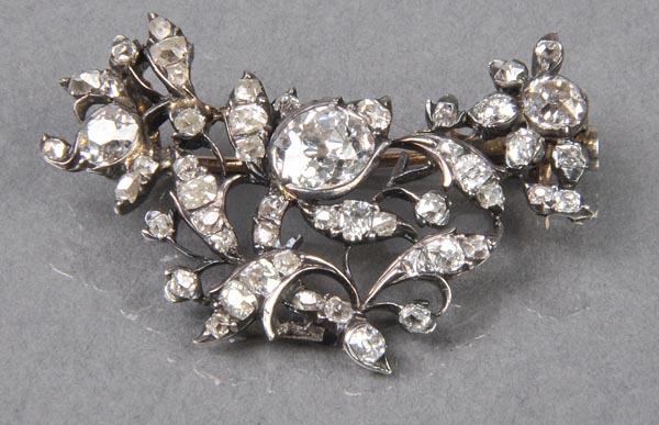 * Diamond Brooch. An early 19th century floral brooch set with large oval brilliant cut stone