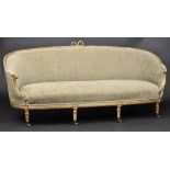 * Sofa. A George III giltwood sofa, the wide curved back with ribbon tied moulding to the centre,