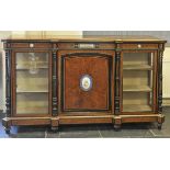 * Credenza. A Victorian amboyna credenza, c. 1870, the top crossbanded with ebony and tulipwood