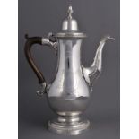* Coffee Pot. A George III silver coffee pot, of baluster form with urn finial and beaded lid and
