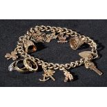 * Charm Bracelet. A modern 9ct gold charm bracelet with twelve charms including William Shakespeare,