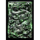 * Panel. An interesting and well carved Chinesee chloromelanite panel, carved in relief with a
