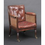 * Armchair. A Regency mahogany bergerŽ library armchair, with reeded frame, leather upholstered