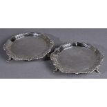 * Salvers. A pair of 18th century Irish silver salvers, each engraved with scroll and shaped