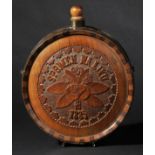 * Hardwood. A late 19th century Continental treen water bottle, of circular form carved in relief