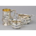 * Silver Mug. A Victorian silver baluster mug, embossed and engraved with foliate decoration
