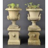 * Urns. A pair of Victorian terracotta garden urns, c. 1890, each of campagna form on square bases