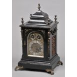 * Clock. An Edwardian ebonised mantel clock, with brass dial, silvered chapter ring engraved with