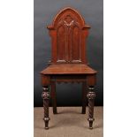 * Hall Chair. A Victorian Gothic mahogany hall chair, the arched back carved with a quatrefoil,