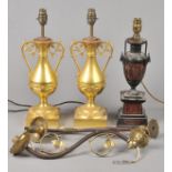 * Table Lamps. A pair of Victorian gilt metal table lamps, of pedestal vase form with foliate scroll