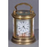 * Carriage Timepiece. A 1920s circular brass carriage clock by Elliott & Sons, London, with white