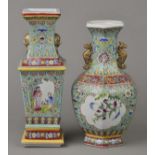 * Chinese Vases. A Chinese porcelain square footed baluster vase with lug handles, decorated with