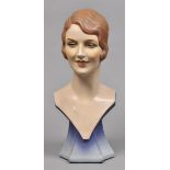 * Art Deco. A well modelled female bust circa 1930/40s, with characterful face on shaped socle, 58cm