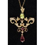 * Pendant. An Edwardian 9ct gold pendant and chain, set with garnets, peridot and pearls within a