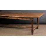 * Table. A large oak refectory table, circa 1920s, with fixed rectangular top arranged in three