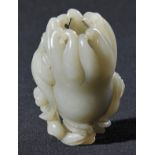 * Pebble. A Chinese celadon jade pebble, late 18th century, carved depicting Buddhas hand with leafy