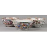 * Chinese Export Ware. A group of three Chinese export porcelain bowls, decorated with flowers and