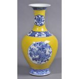 * Chinese Vase. A Chinese porcelain baluster vase, decorated in a yellow glaze with three roundels