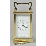 *Orient Express. A modern brass carriage clock produced for the Orient-Express, with white dial with