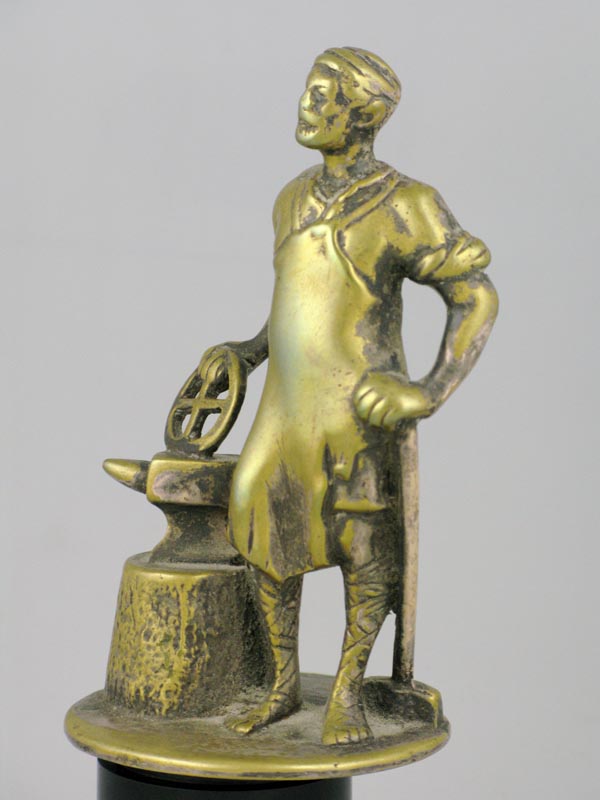 *Vulcan. A small, 4.5-inch high mascot, polished brass, but good detail, not mounted. (1)
