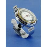 *Cycling Pocket Watch. A handlebar-mounted pocket-watch holder from the 1950s, together with an