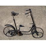 *A Child’s Fairy Bicycle. A black-painted open-frame dual-gender bicycle with a front plunger brake,