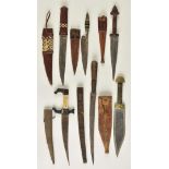 *Africa. A collection of African daggers, including a North African dagger with 18cm steel blade,