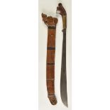 *Golok. A 19th-century Malaysian sword, the 53cm swollen blade engraved with scrolls along the top