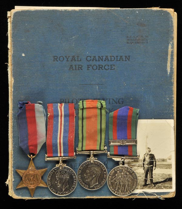 *WWII Logbook. A group of five attributable to Pilot Officer R.N.G. Harvey, Royal Canadian Air
