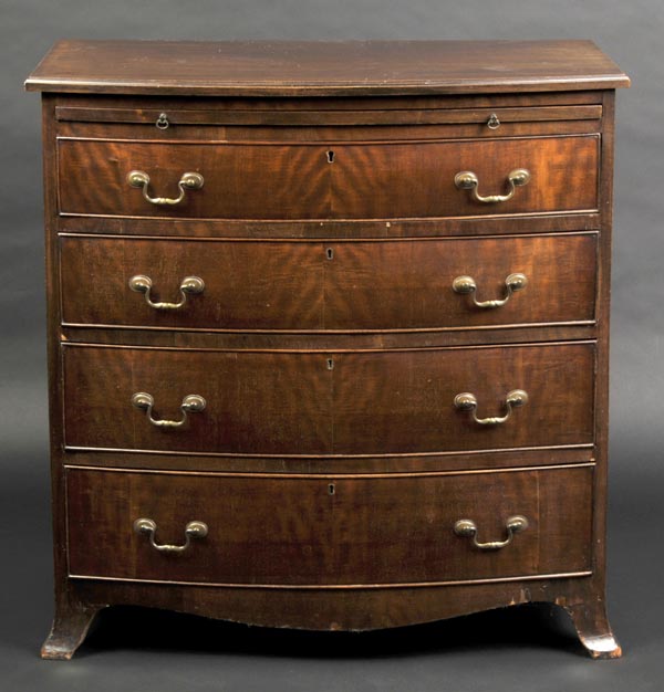 * Chest of drawers. An Edwardian George III style mahogany chest of drawers, the bow front top