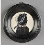 * Silhouette. Portrait of a young woman, circa 1840, circular painted head and shoulders silhouette