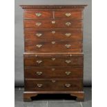 * Tallboy. A George III mahogany chest on chest, the rectangular top with dentil moulding above two