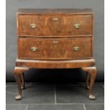 * Chest on stand. A Queen Anne-style walnut bowfront chest on stand, with rosewood crossbanding,